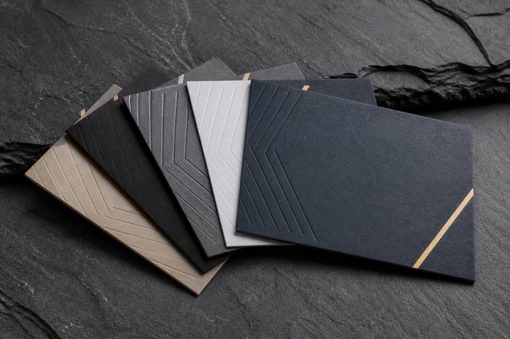 Professional business cards fanned on slate stone